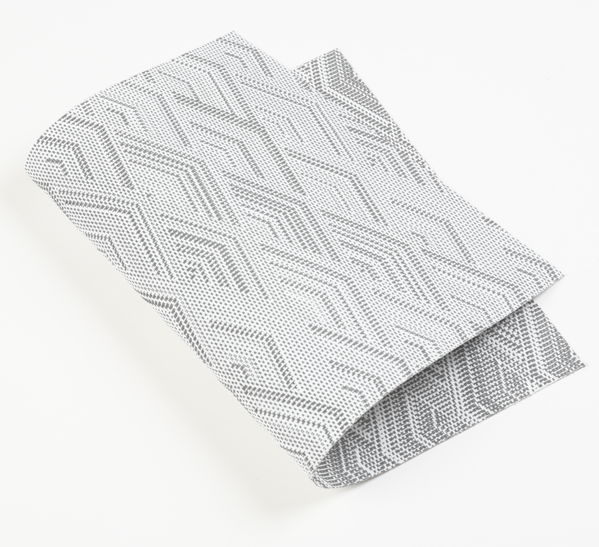 Gewebtes Tischset aus weißem Polypropylen mit grauem geometrischem Muster und strukturierter Oberfläche