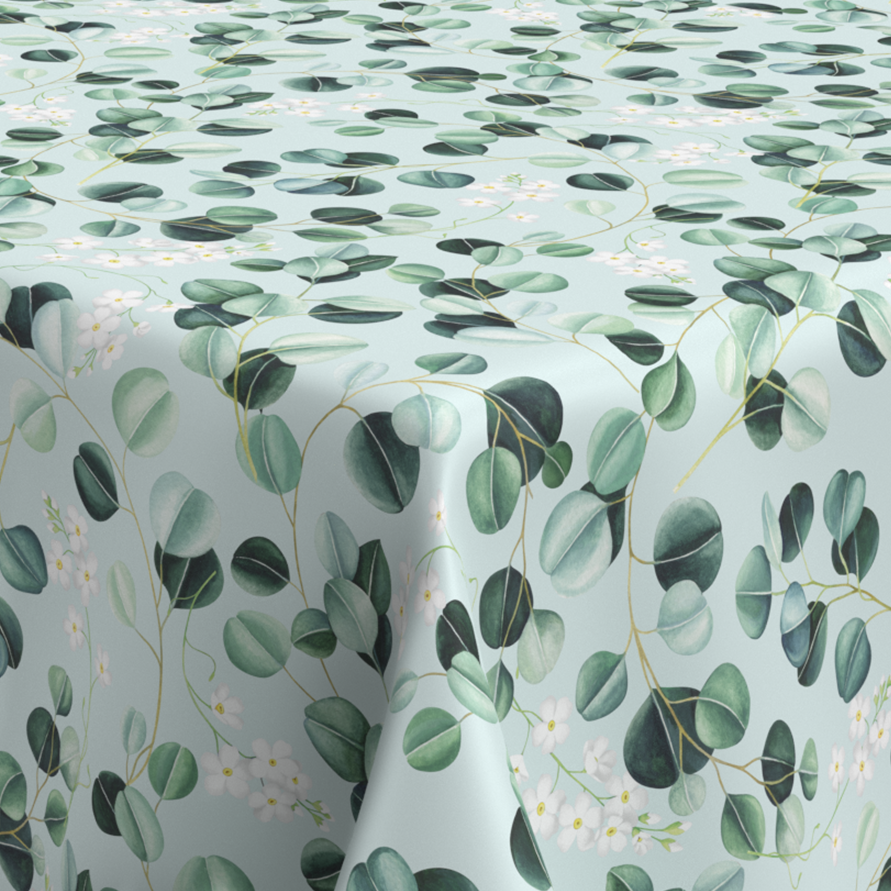 Wachstischdecke Blätter aus PVC in Mint- und Grüntönen mit Eukalyptusblättern und zarten Blüten
