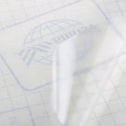 Buchfolie glänzend aus transparenter PVC-Folie mit selbstklebender Rückseite und kariertem Trägerpapier
