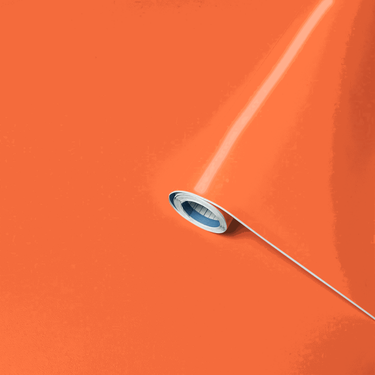 Leuchtfolie Vénilia in leuchtendem Orange, selbstklebende Folie als aufgerollte Materialbahn
